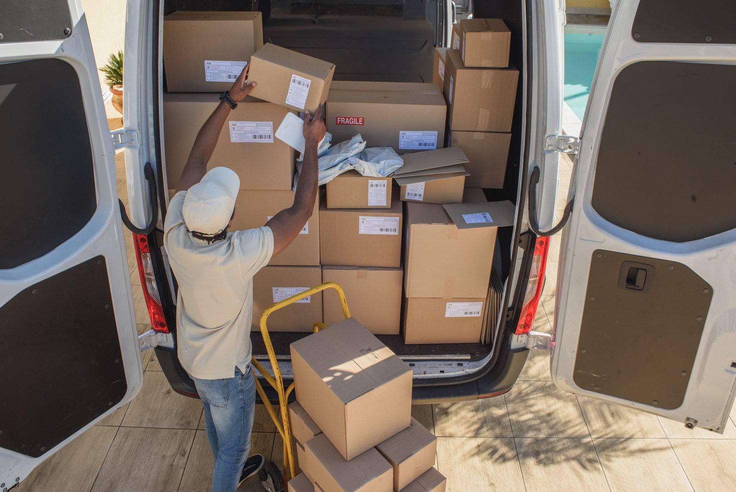 Courier Service Delivery Man Taking Parcels from Van