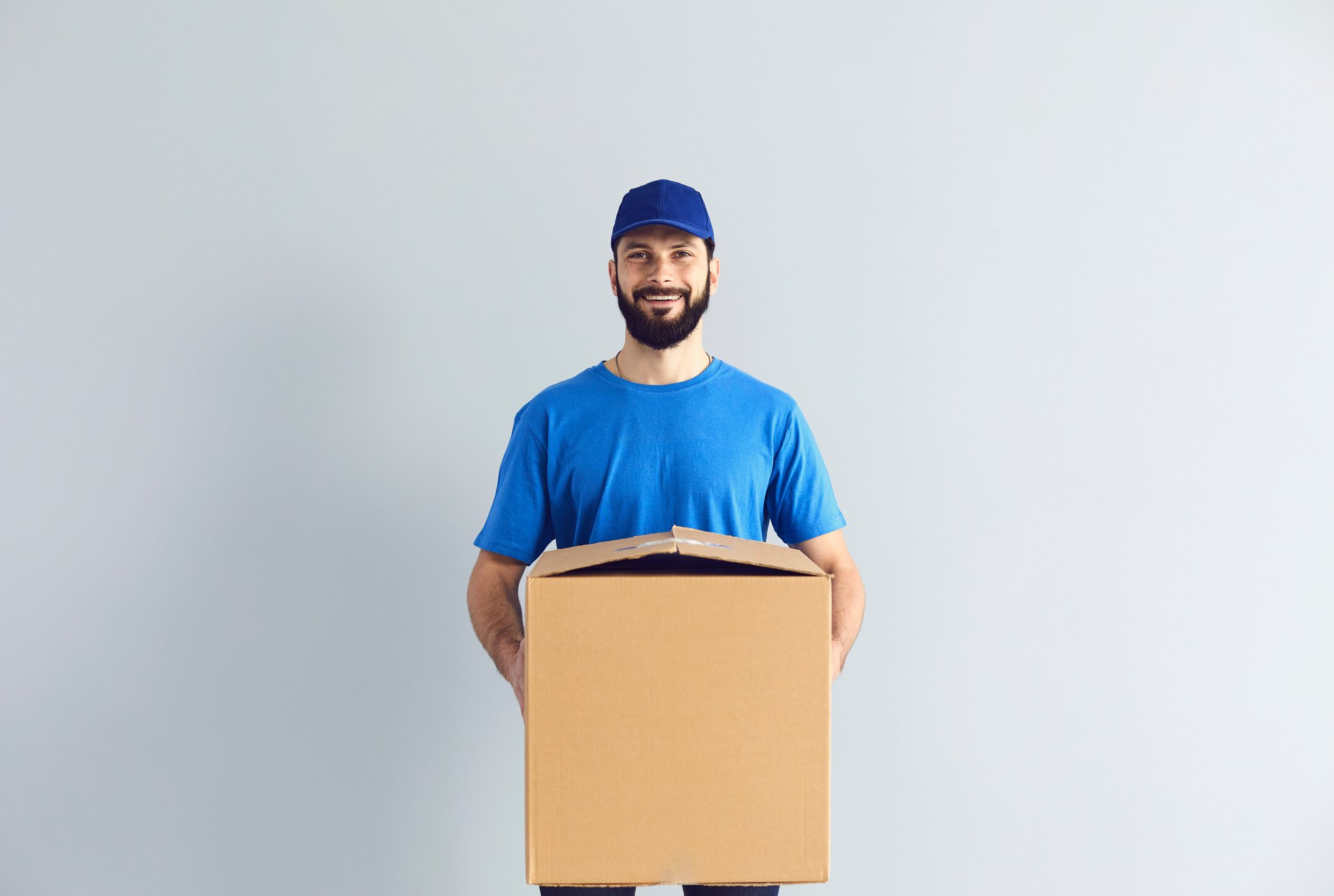 Happy Male Courier Smiling for Camera